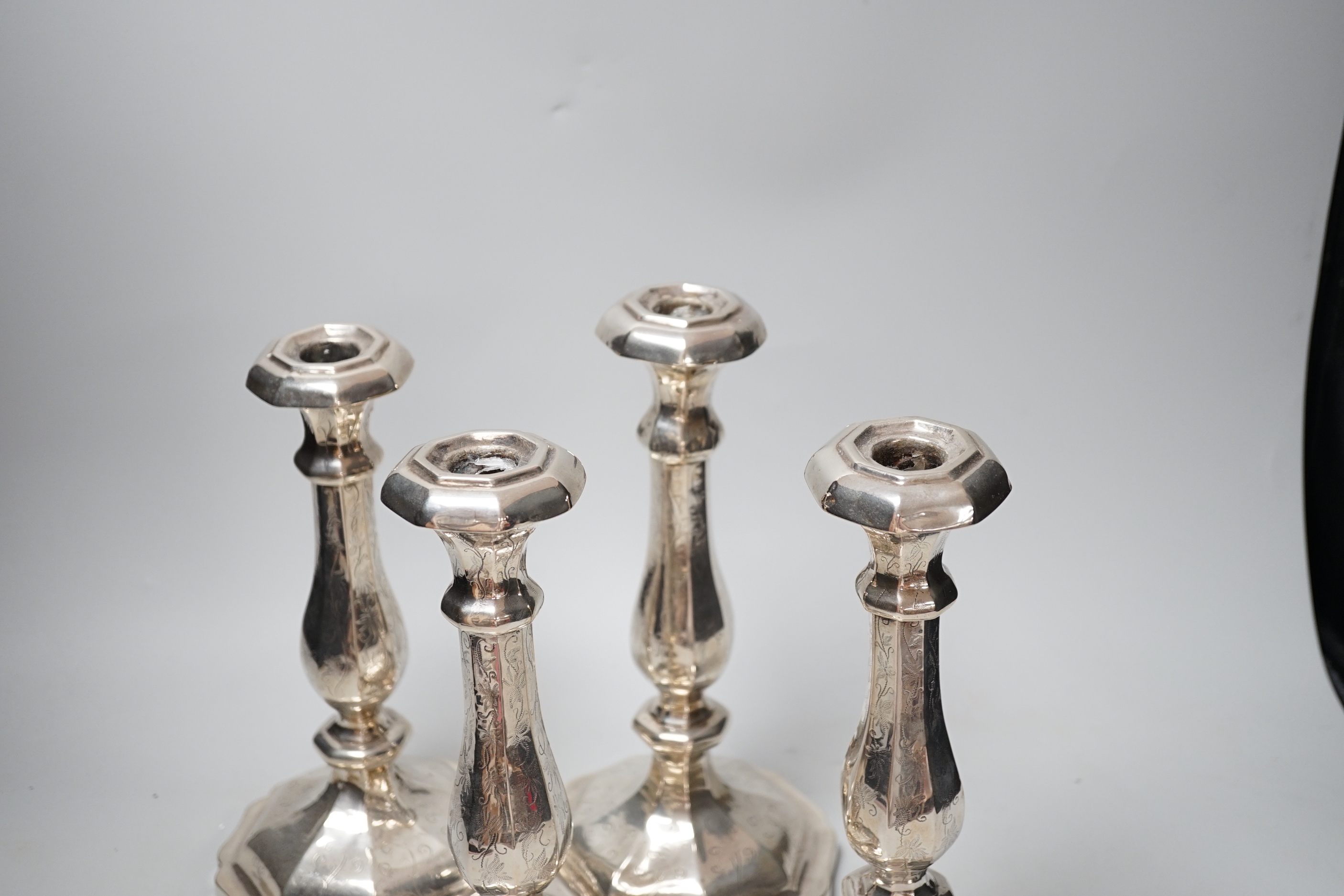 A set of four 19th century Austro-Hungarian white metal candlesticks, dated 1863, height 27.4cm, et infra (a.f.), weighted.